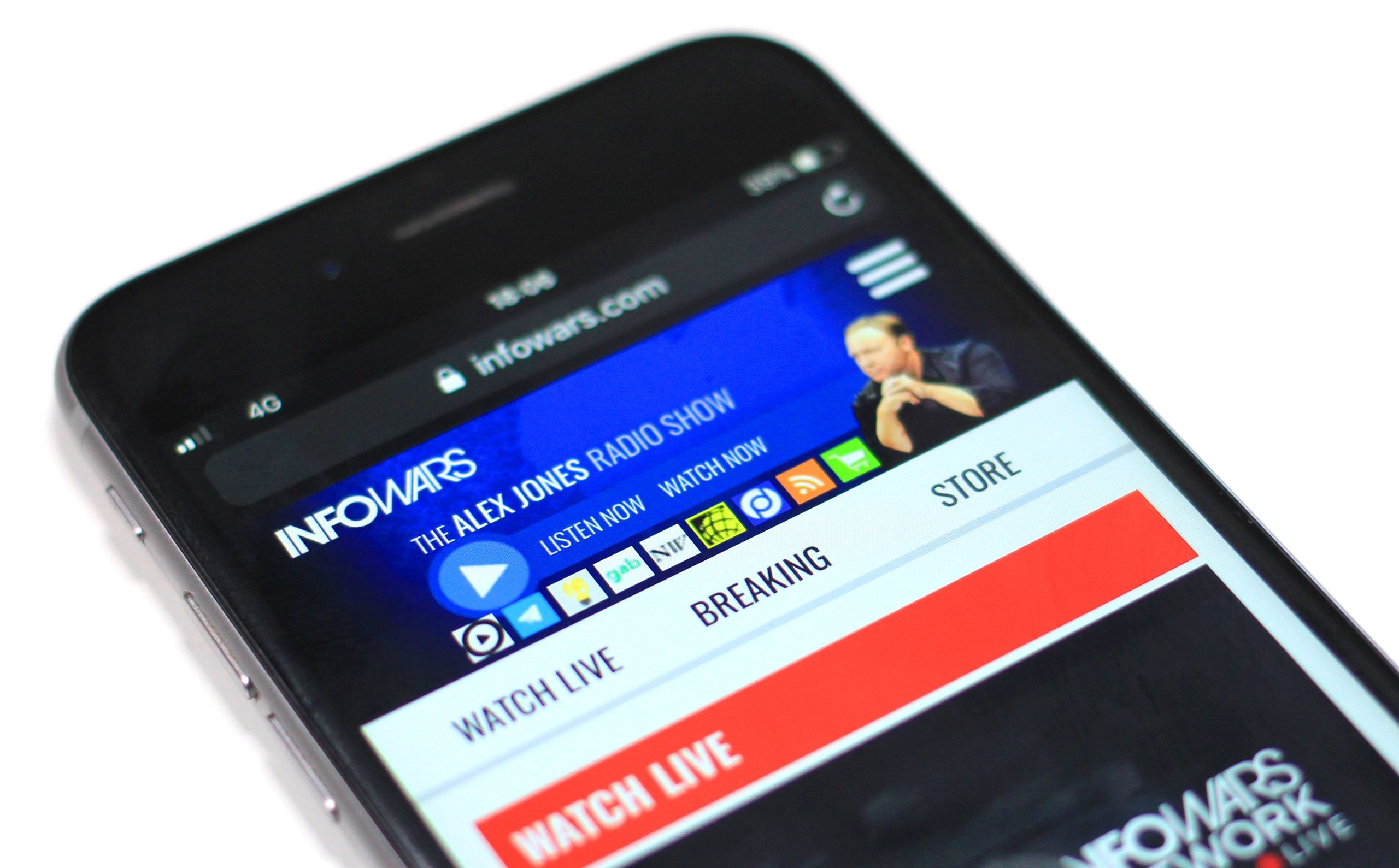 Mobile phone with a "Watch Live" video playing